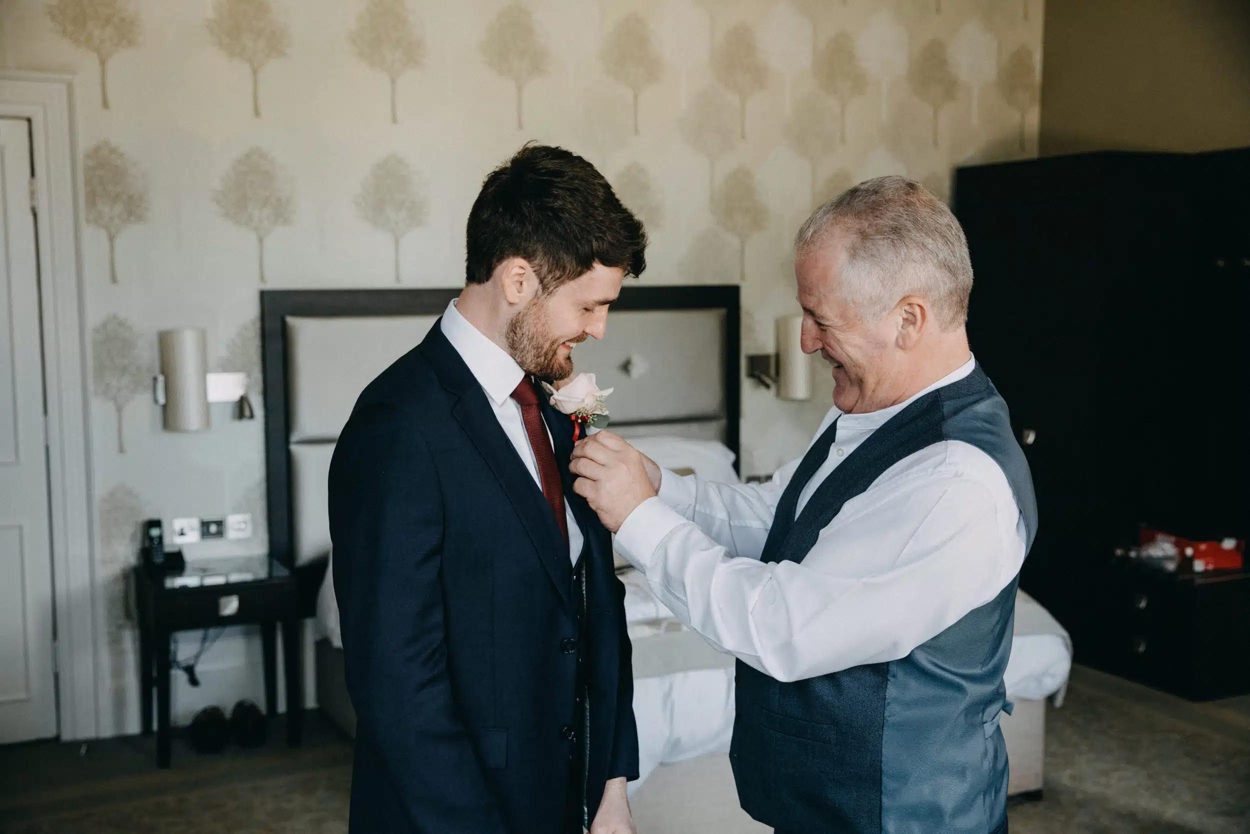 Groom & father figure getting ready for wedding